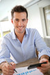 Man working from home on smartphone