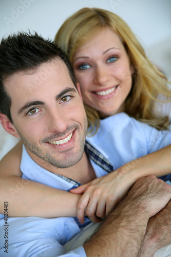Photo: Cheerful in love couple at home Cheerful in love couple at home
