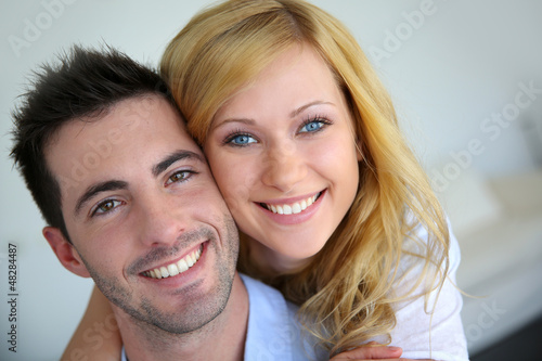 Photo: Cheerful in love couple at home Cheerful in love couple at home