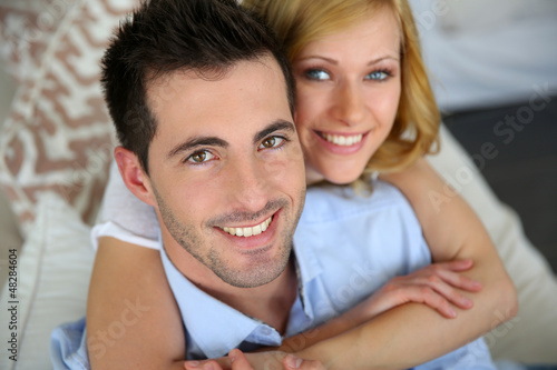 Photo: Portrait of cheerful in love couple at home Portrait of cheerful in love couple at home