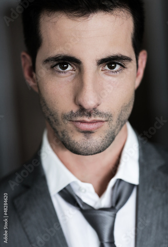 Photo: Portrait of handsome man on dark background Portrait of handsome man on dark background