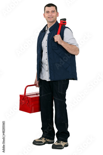 Photo: portrait of craftsman against studio background portrait of craftsman against studio background