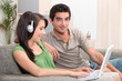 Teens sitting on couch