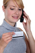 Woman on the phone with her credit card company