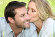 Woman kissing man