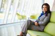 Portrait Of Businesswoman Sitt...