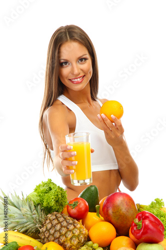 Photo: beautiful young woman with fruits and vegetables and glass of beautiful young woman with fruits and vegetables and glass of