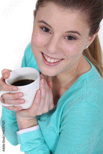 Photo: Happy woman drinking coffee Happy woman drinking coffee