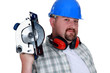 Bearded man holding circular-saw