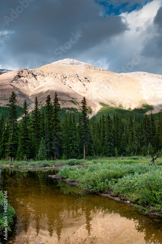 Photo: Mountain scenery with small pond in Banff national park Mountain scenery with small pond in Banff national park