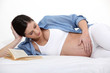 Photo: pregnant woman lying in her bed pregnant woman lying in her bed