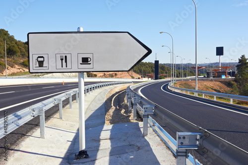 Photo: road sign along a highway road sign along a highway