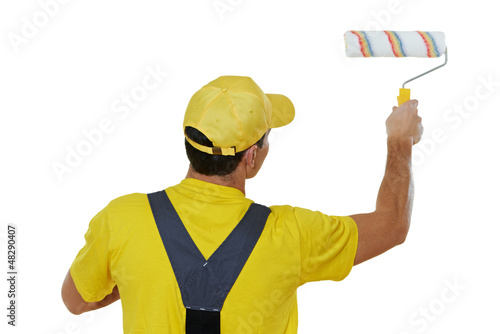 Photo: painter man in uniform with paint roller painter man in uniform with paint roller