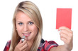 woman holding a red card