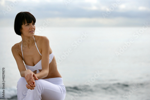 Photo: Contemplative woman by the sea Contemplative woman by the sea