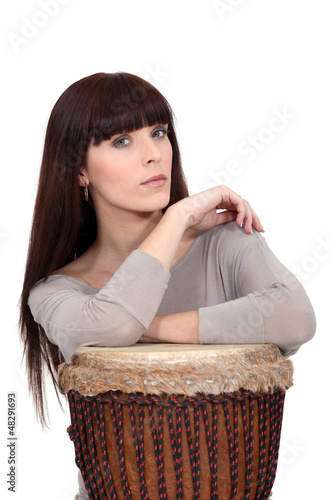 Photo: Woman with a djembe drum Woman with a djembe drum