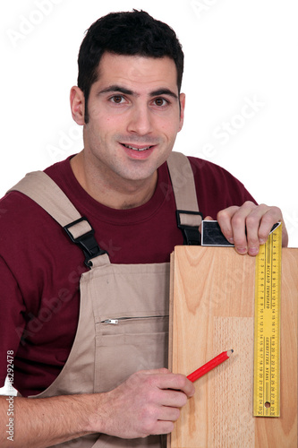 Photo: Tradesman using a try square Tradesman using a try square