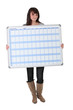 Young woman with a planning board