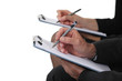 Two businesspeople with clipboards