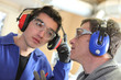 Foto: Men wearing ear defenders Men wearing ear defenders