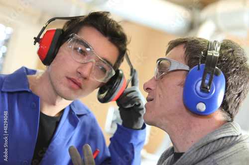 Photo: Men wearing ear defenders Men wearing ear defenders