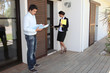 Foto: man and female realtor near house man and female realtor near house