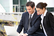 Business couple with a laptop computer