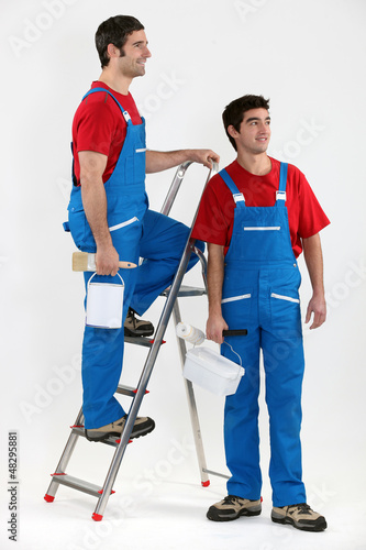 Photo: Two decorators stood by ladder Two decorators stood by ladder