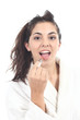 Woman painting her lips with a lipstick