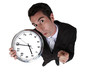 High-angle shot of a businessman holding a clock