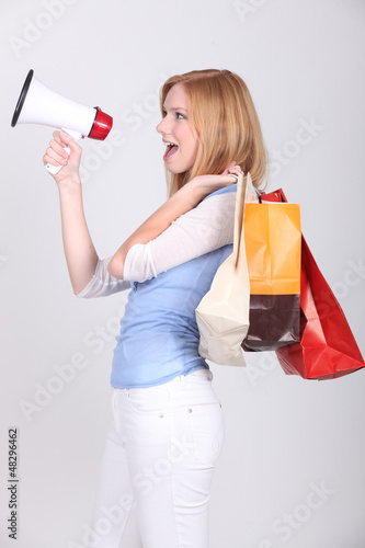 Photo: Woman announcing shopping deals Woman announcing shopping deals