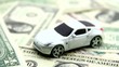 Expensive new car on paper money.