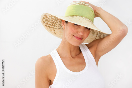 Photo: Brunette wearing straw hat Brunette wearing straw hat