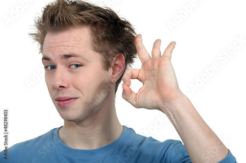 Photo: young man making okay sign young man making okay sign