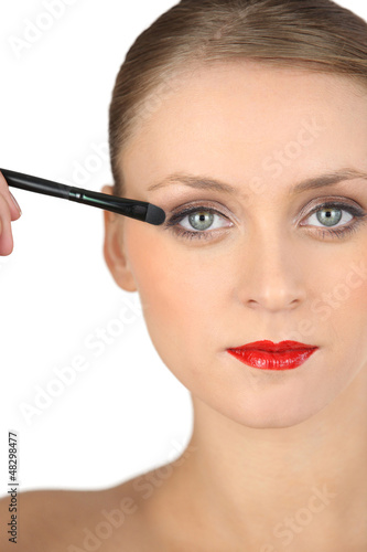 Photo: Sophisticated girl making-up Sophisticated girl making-up