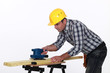 Workman using a power tool