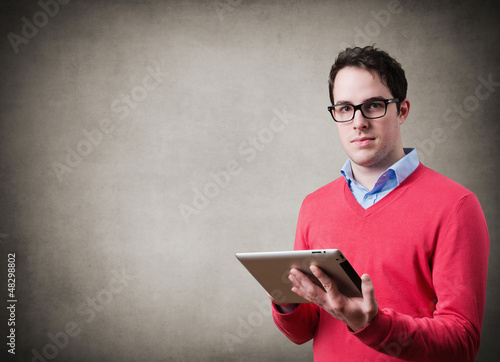 Photo: Young man with tablet Young man with tablet