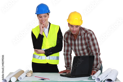 Photo: Tradesman and engineer working together Tradesman and engineer working together