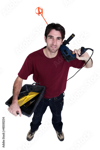 Photo: Decorator with a drill and mixing paddle Decorator with a drill and mixing paddle