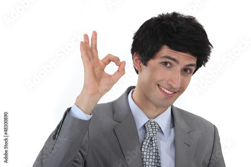 Photo: businessman making an OK sign businessman making an OK sign