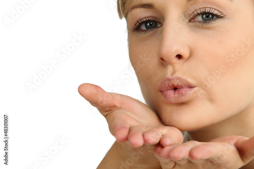 Photo: Woman blowing a kiss Woman blowing a kiss