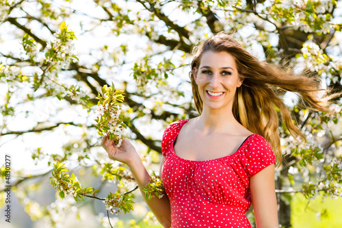 Photo: Girl in spring and tree blossom Girl in spring and tree blossom