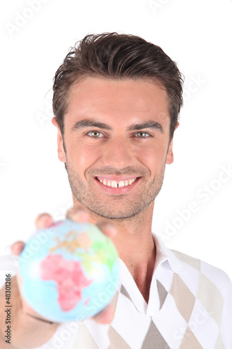 Photo: Man holding globe Man holding globe