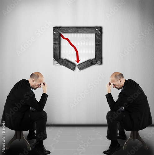 Photo: Bad business figures - business crises concept Bad business figures - business crises concept
