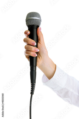 Photo: female hand with microphone isolated on white female hand with microphone isolated on white