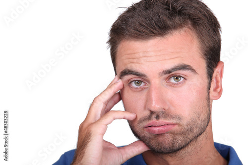 Photo: Portrait of upset man Portrait of upset man