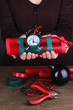 Human makes timebomb on wooden table on black background