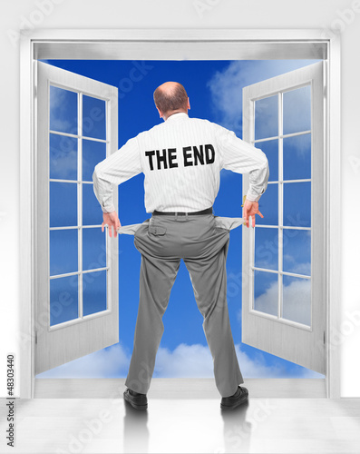 Photo: Bankruptcy metaphor. Businessman with empty pockets. Bankruptcy metaphor. Businessman with empty pockets.