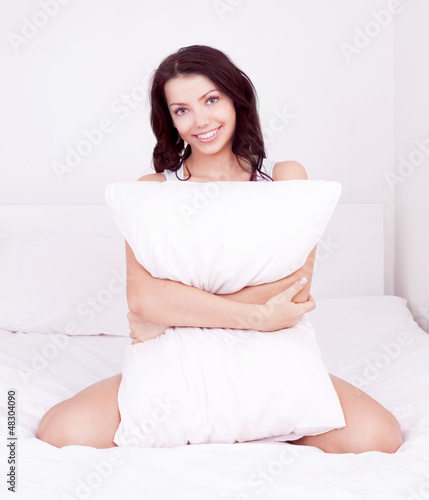 Photo: woman with a pillow woman with a pillow