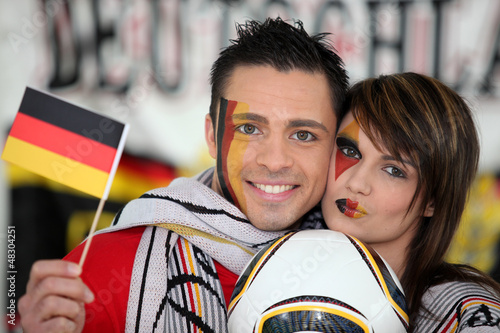 Photo: Couple supporting German football team Couple supporting German football team